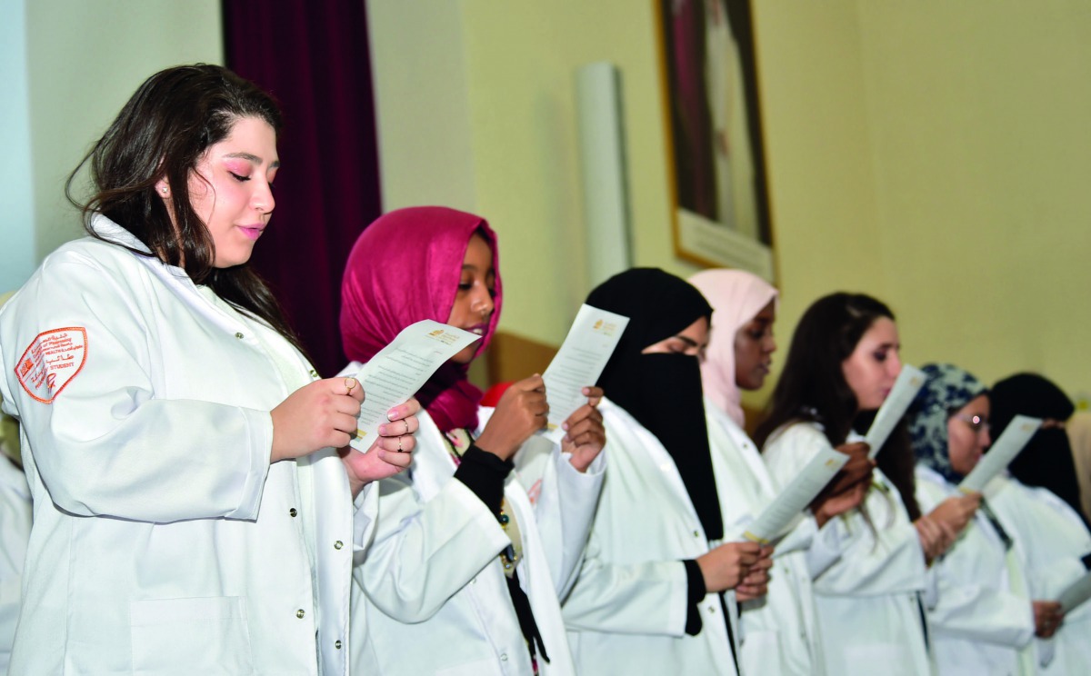 New pharmacy students, class of 2022, taking the symbolic Oath at the 12th Annual White Coat Ceremony.