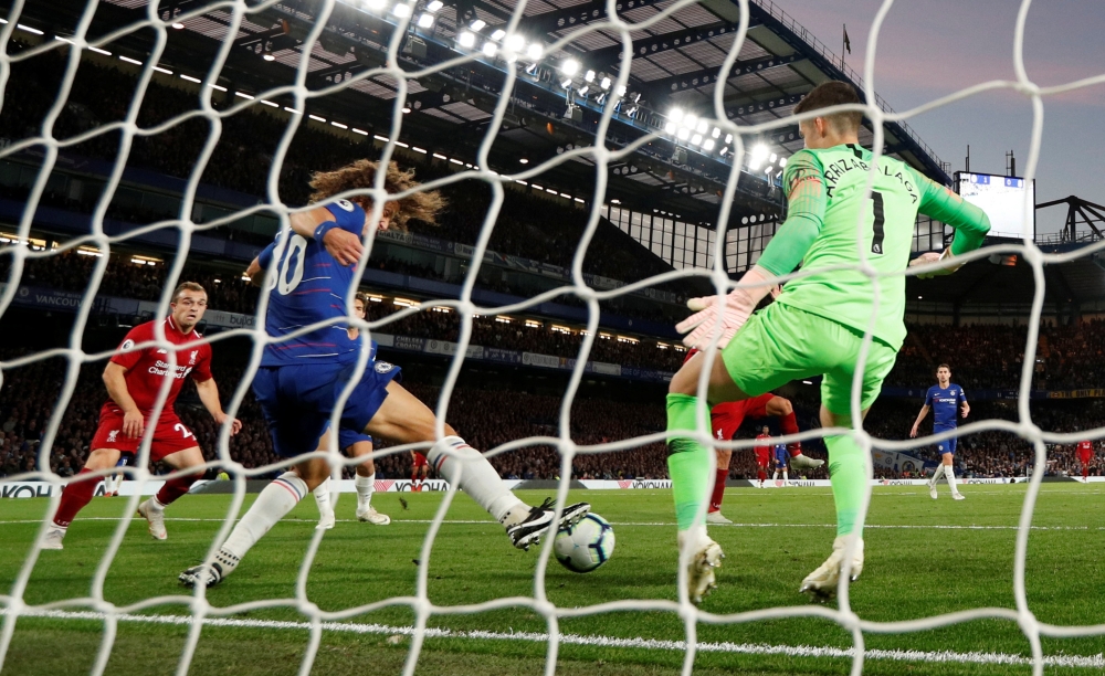 Chelsea's David Luiz blocks Liverpool's Roberto Firmino's shot on goal Action Images via Reuters/John Sibley 