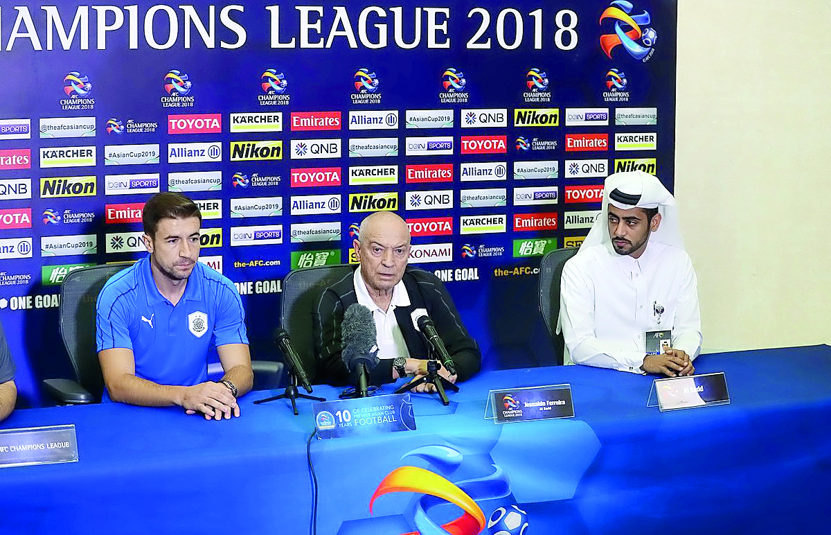 Al Sadd coach Jesualdo Ferreira (centre) and Al Sadd midfielder  Gabi Fernandez (left) during a pre-match press conference yesterday. 
