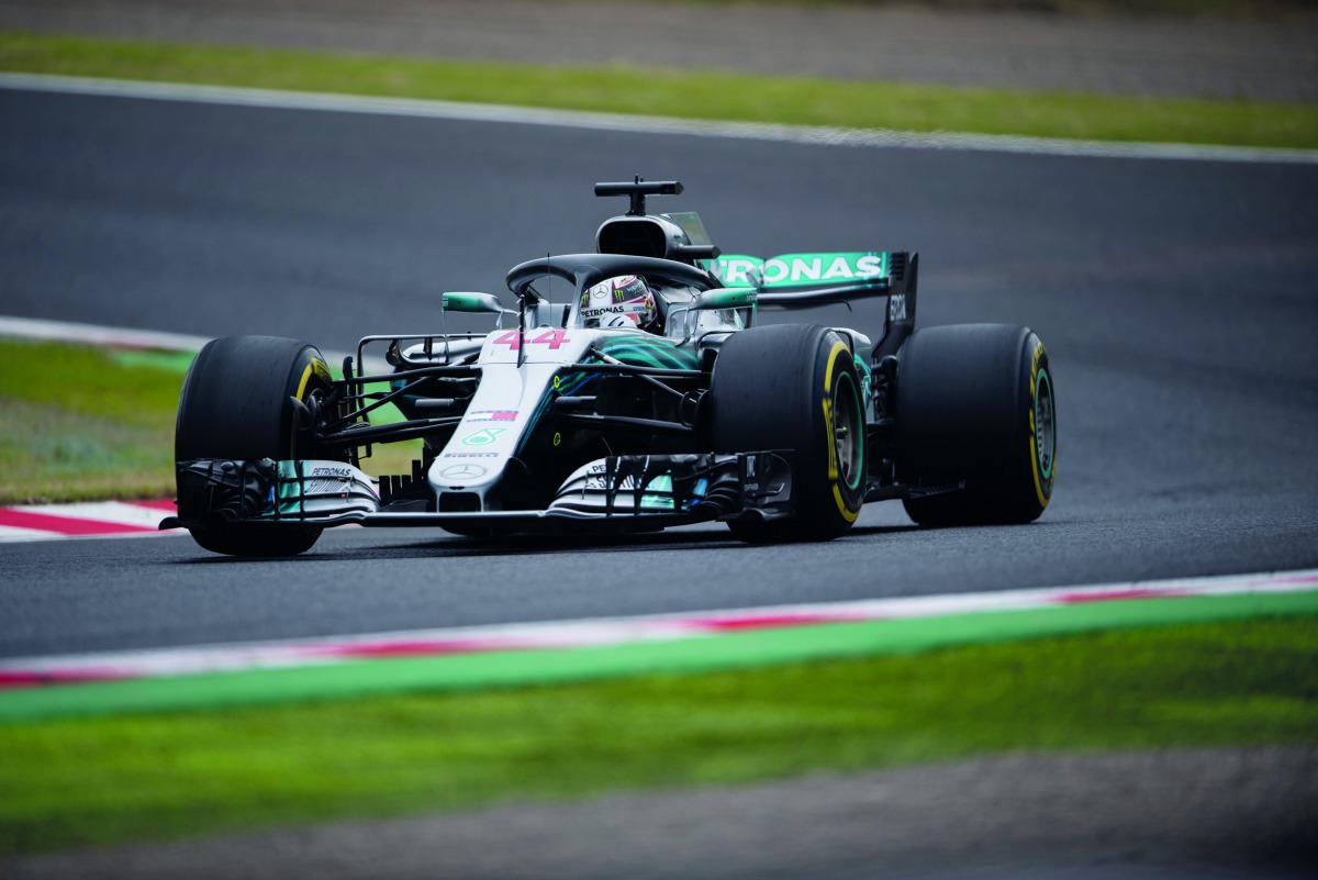 Mercedes' British driver Lewis Hamilton steers his car during the second practice session for the Formula One Japanese Grand Prix in Suzuka on October 6, 2018. AFP / Martin Bureau

