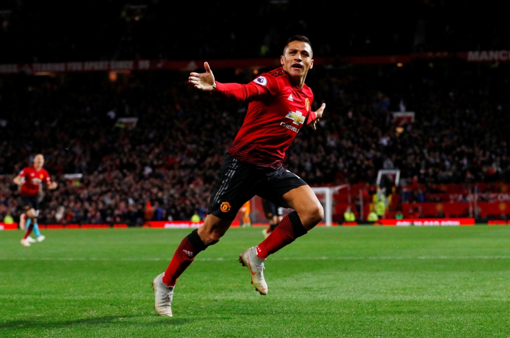 Manchester United's Alexis Sanchez celebrates scoring their third goal REUTERS/Phil Noble EDITORIAL