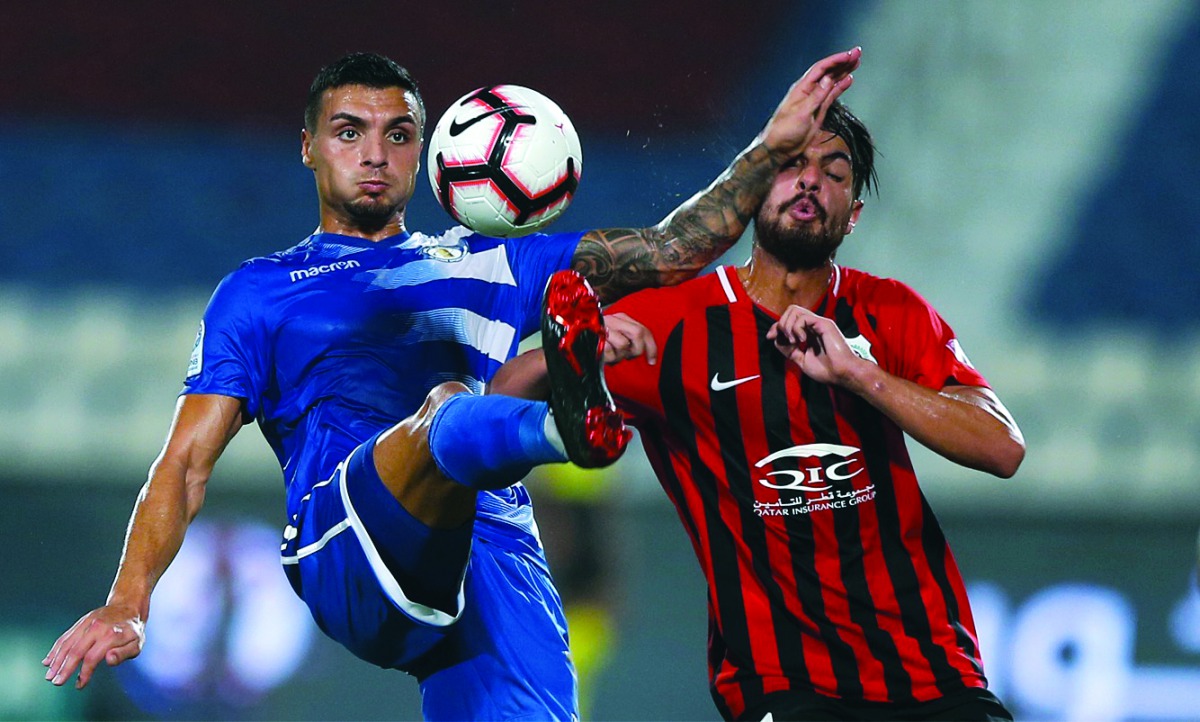 Players of Al Khor and Al Rayyan vie for ball possession during the QNB Stars League at Al Khor Stadium yesterday.