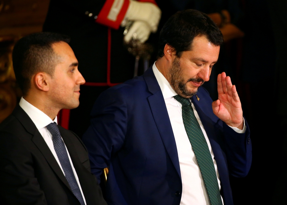 FILE PHOTO: Interior Minister Matteo Salvini gestures next to Italy's Minister of Labor and Industry Luigi Di Maio at the Quirinal palace in Rome, Italy, June 1, 2018. REUTERS/Tony Gentile/File Photo