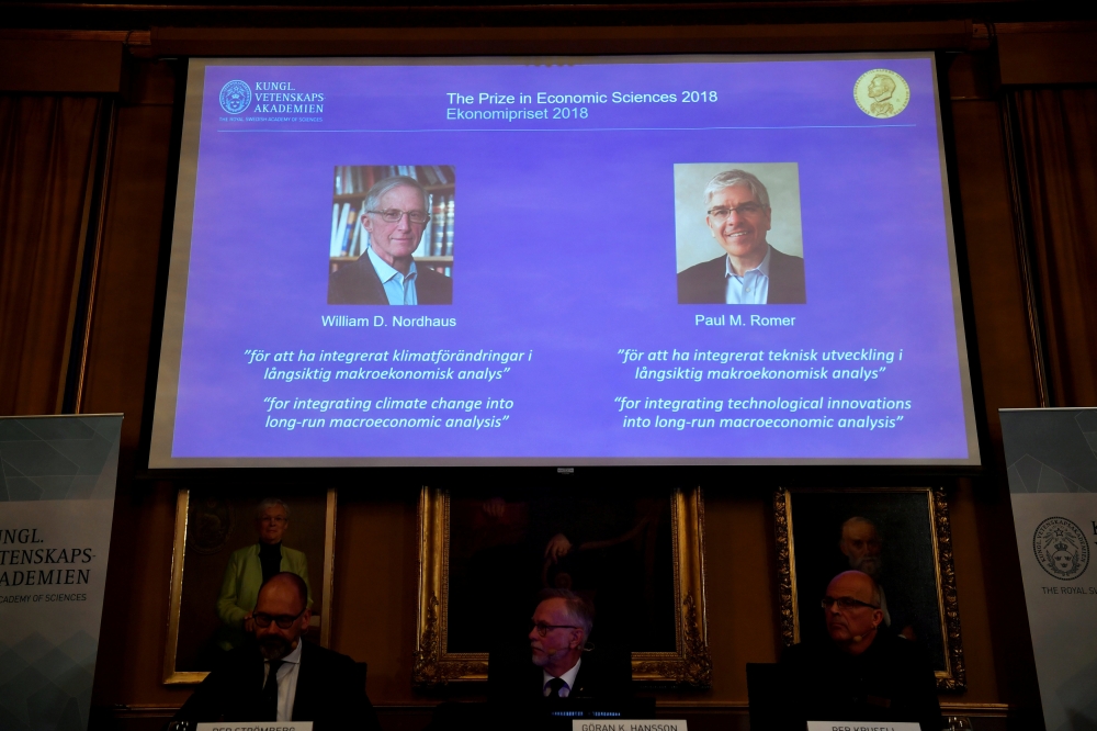 Per Stromberg, Goran K. Hansson and Per Krusell announce the laureates of the Nobel Prize in Economics during a press conference at the The Royal Swedish Academy of Sciences in Stockholm, Sweden, October 8, 2018.  TT News Agency
