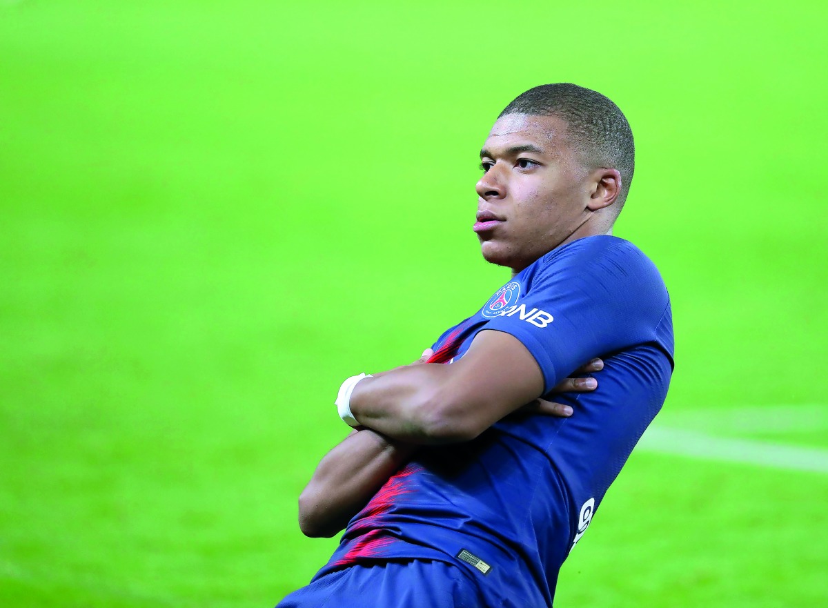 Kylian Mbappe of Paris Saint-Germain celebrates his score during the French Ligue 1 football match between Paris Saint-Germain and Olympique Lyonnais at Parc des Princes Stadium in Paris October 07, 2018. (Mustafa Yalç?n/Anadolu Agency) 
