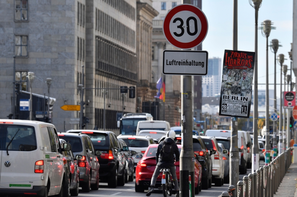 A sign restricting speed to 30km/h in order to curb pollution is seen along one of Berlin's busiest throughways, the Leipzigerstrasse, in Berlin on October 8, 2018.  AFP / John MACDOUGALL