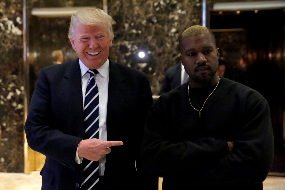 FILE PHOTO: U.S. President-elect Donald Trump and musician Kanye West at Trump Tower in New York City on Dec 13, 2016. REUTERS/Andrew Kelly
