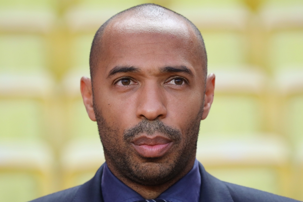 (FILES) In this file photo taken on September 18, 2018 Belgium's national football team assistant coach Thierry Henry looks on prior to the UEFA Champions League first round football match between AS Monaco and Atletico Madrid at the Stade Louis II, in Mo