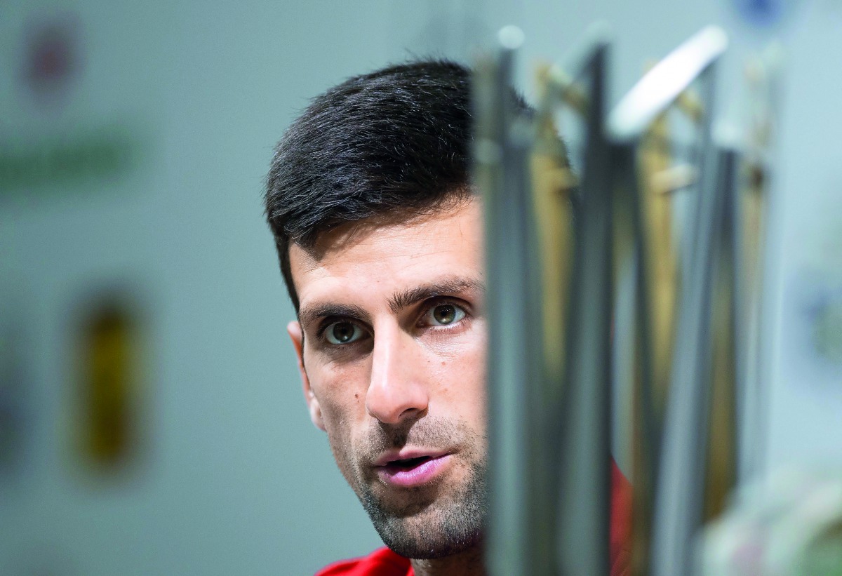 Novak Djokovic of Serbia attends a press conference after beating Borna Coric of Croatia in their men's singles final match at the Shanghai Masters tennis tournament on October 14, 2018.  AFP / Johannes Eisele

