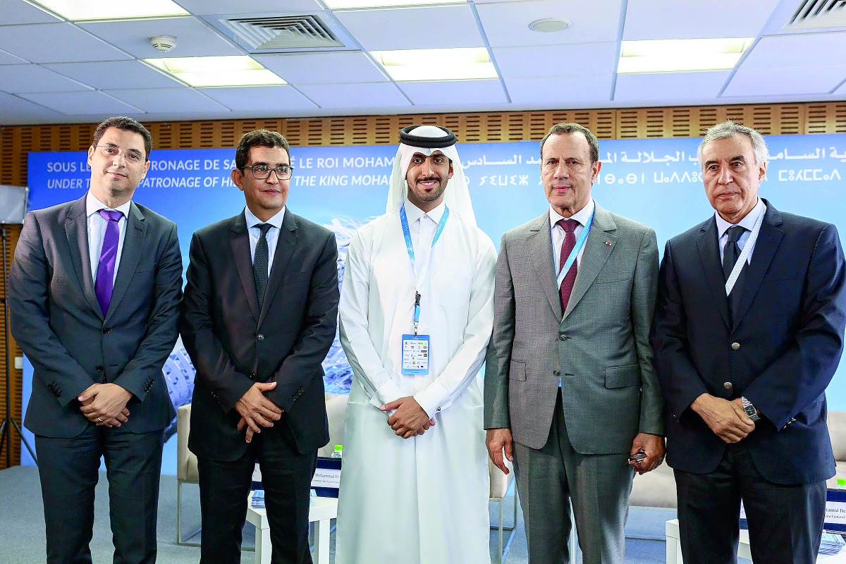 QREC Head of Show Section Hassan Al Mannai (centre) along with other officials pose for a group photo, yesterday. 