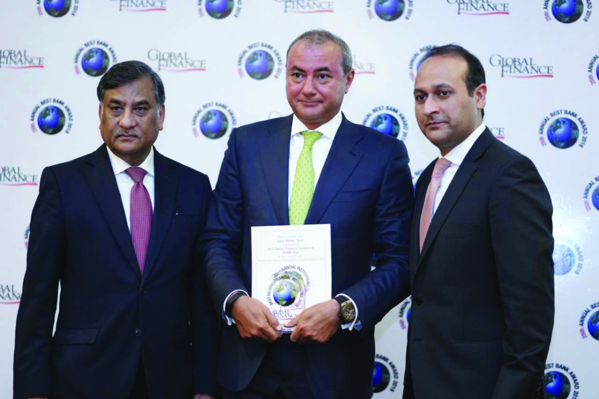 QIB Group CEO Bassel Gamal (centre) with officials during the awards ceremony held in Bali, Indonesia.
