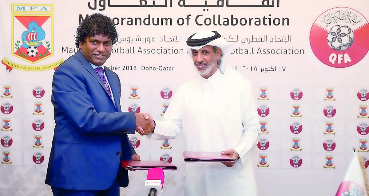 Sheikh Hamad bin Khalifa bin Ahmed Al Thani, President of QFA, and Mohamed Ali Samir Sobha, President of MFA shake hands after the signing ceremony, yesterday.