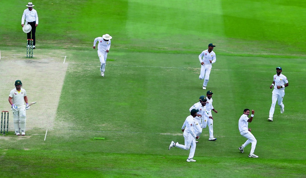 Pakistan batsman Mohammad Abbas (R) celebrates after dismissing Australian cricketer Aaron Finch during day four of the second Test match between Australia and Pakistan at Sheikh Zayed stadium in Abu Dhabi on October 19, 2018. AFP /Karim Sahib