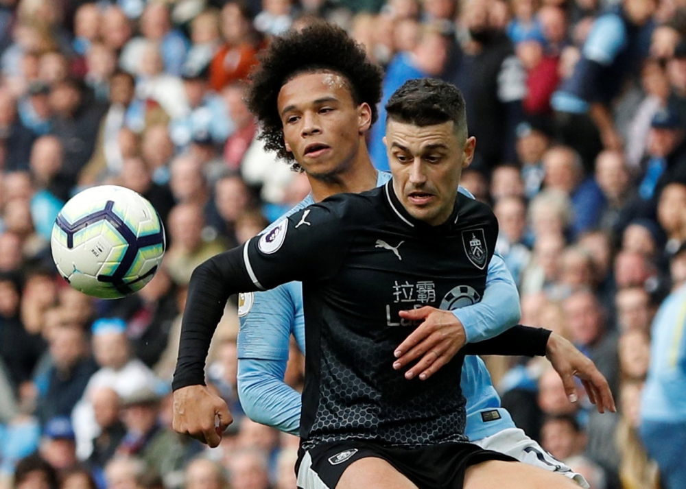 Manchester City's Leroy Sane in action with Burnley's Matthew Lowton REUTERS/Darren Staples 