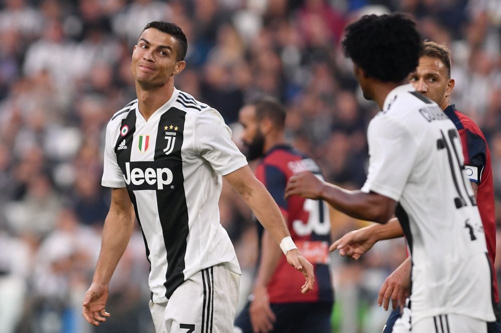 Juventus' Portuguese forward Cristiano Ronaldo reacts during the Italian Serie A football match Juventus vs Genoa on October 20, 2018 at the Juventus Allianz stadium in Turin. / AFP / Marco BERTORELLO