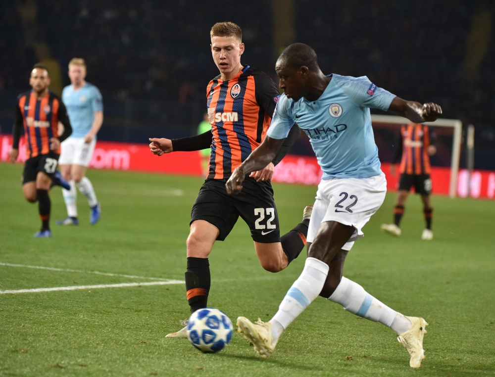 Shakhtar's Ukrainian defender Mykola Matviyenko (L) vies with Manchester City's French defender Benjamin Mendy during the UEFA Champions League football match between Shakhtar Donetsk and Manchester City at the Metallist stadium in Kharkiv, on October 23,