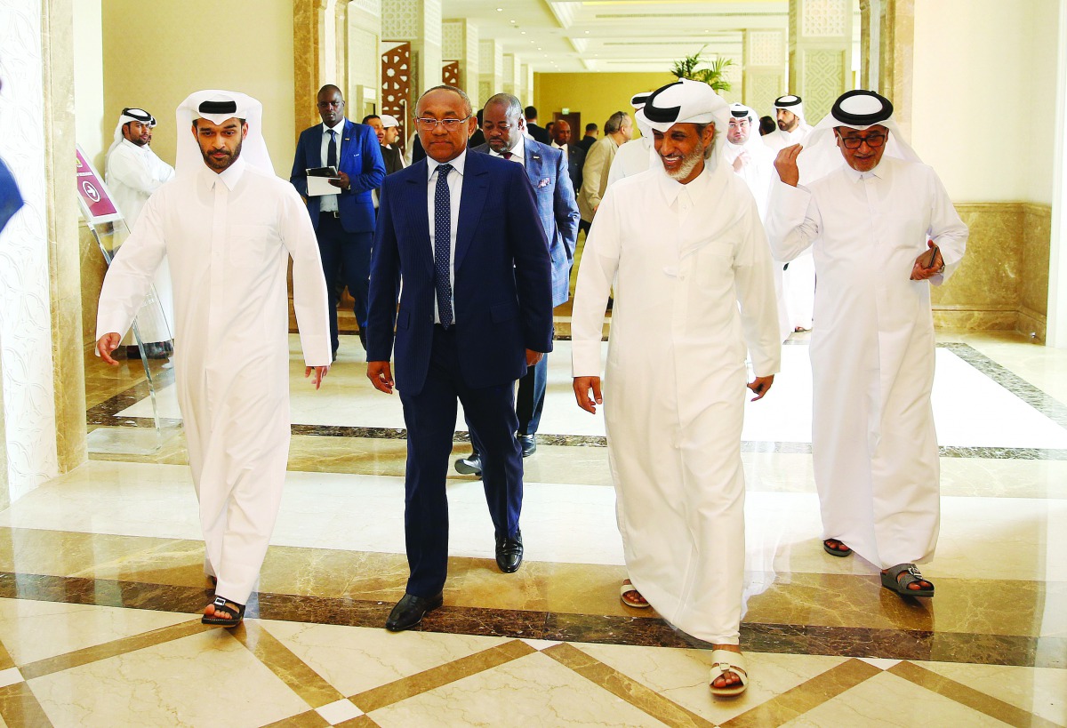 Ahmad Ahmad (second left), President of Confederation of African Football delegation, is seen along with Sheikh Hamad bin Khalifa bin Ahmed Al Thani (second right), President of Qatar Football Association (QFA), Hassan Al Thawadi (left), Secretary-General