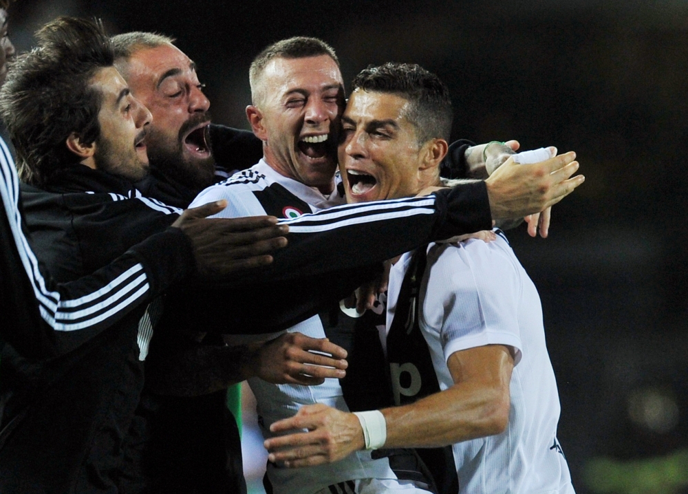 Juventus' Cristiano Ronaldo celebrates scoring their second goal with Federico Bernardeschi and team mates REUTERS/Jennifer Lorenzini TPX IMAGES OF THE DAY