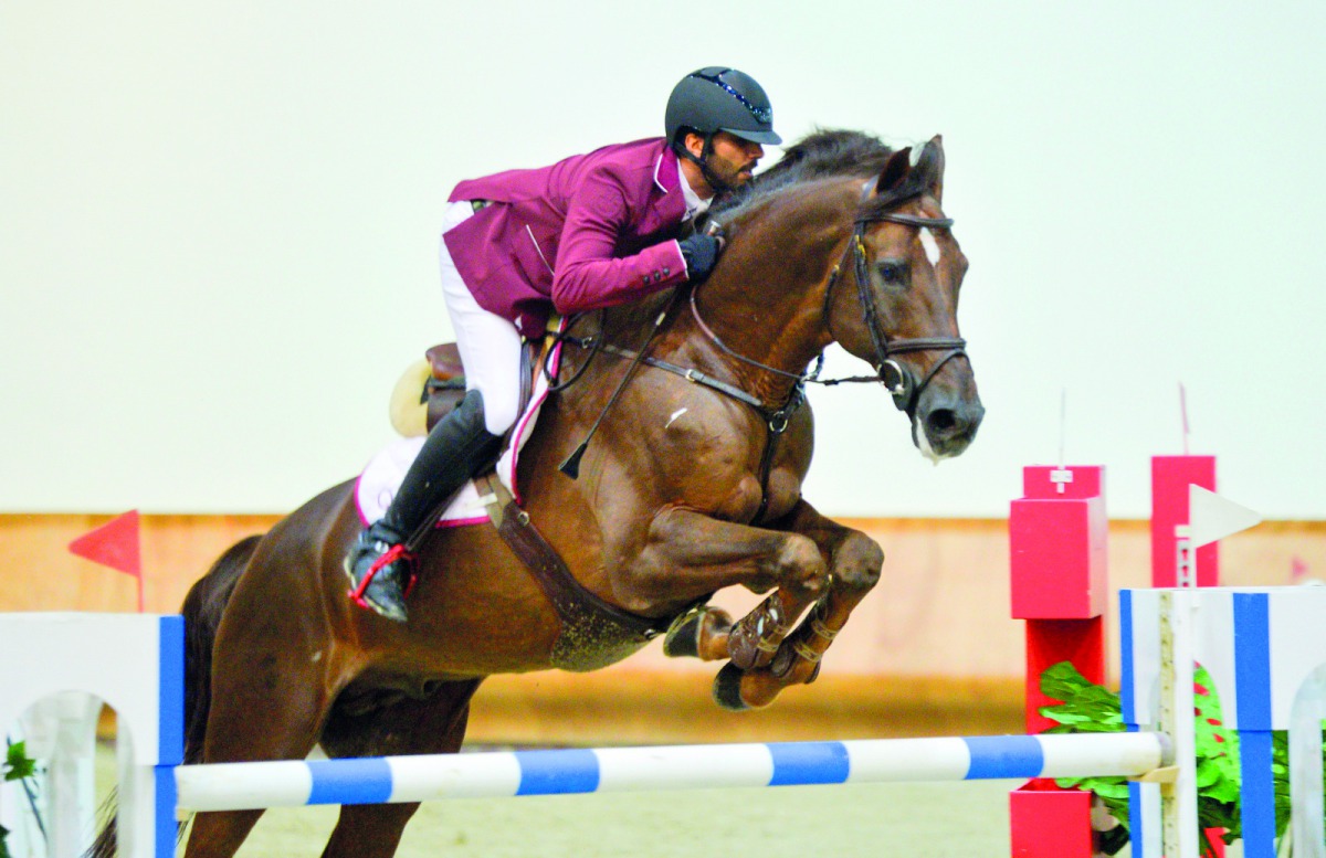 Mubarak Yousuf Al Rumaihi guides Vivaldi K over an obstacle during the Big Tour of the second round of the Hathab Tour at the Indoor Arena of Qatar Equestrian Federation (QEF) yesterday.