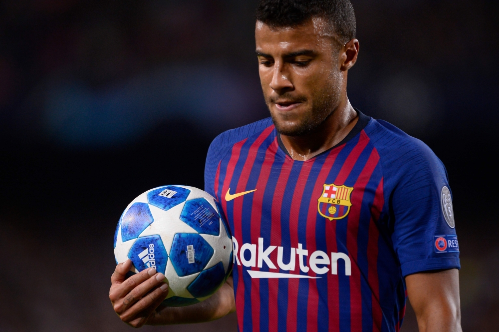 Barcelona's Brazilian midfielder Rafinha grabs the ball during the UEFA Champions League group B match Barcelona against Inter Milan at the Camp Nou stadium in Barcelona on October 24, 2018. / AFP / Josep LAGO