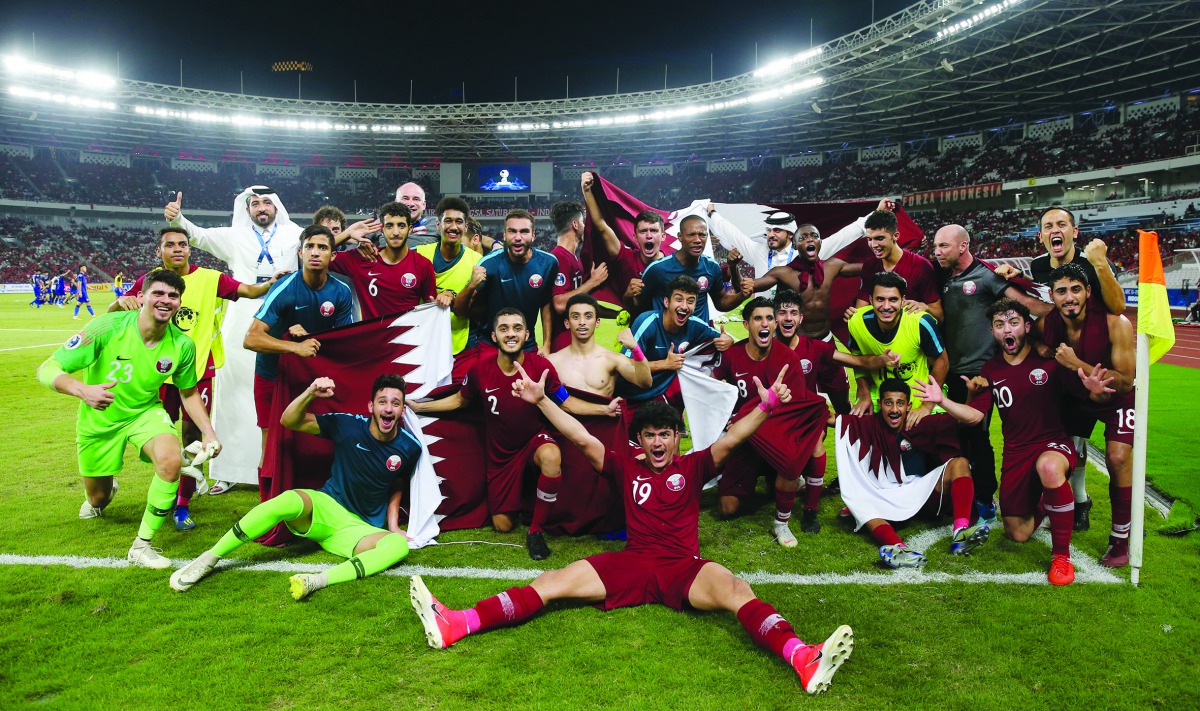 Qatar players and officials celebrate after winning their AFC U-19 Championship quarter-final match against Thailand yesterday. 