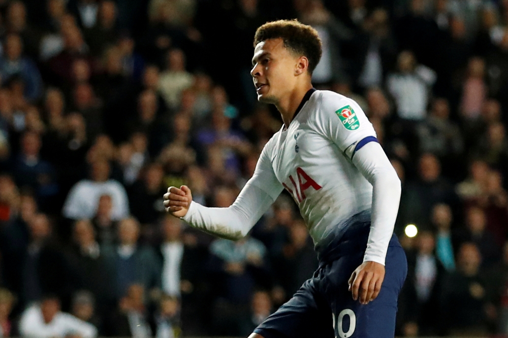 Tottenham's Dele Alli reacts after scoring the winning penalty during the shootout Action Images via Reuters/Andrew Boyers/File Photo