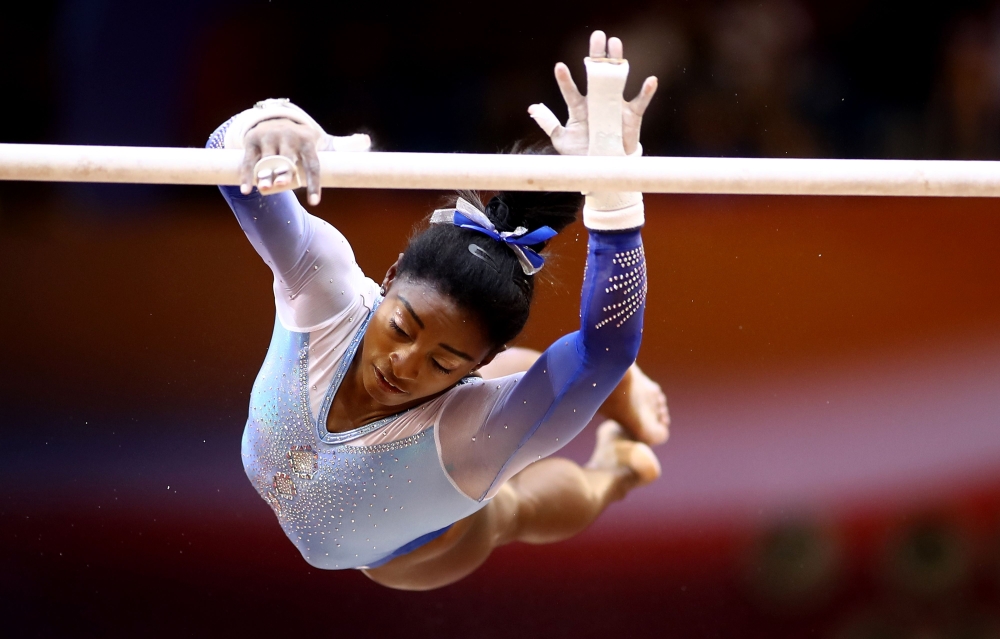 Simone Biles of the United States competes on the uneven bars during day nine of the 2018 FIG Artistic Gymnastics Championships at the Aspire Dome on November 2, 2018 in Doha, Qatar. (AFP / KARIM JAAFAR)