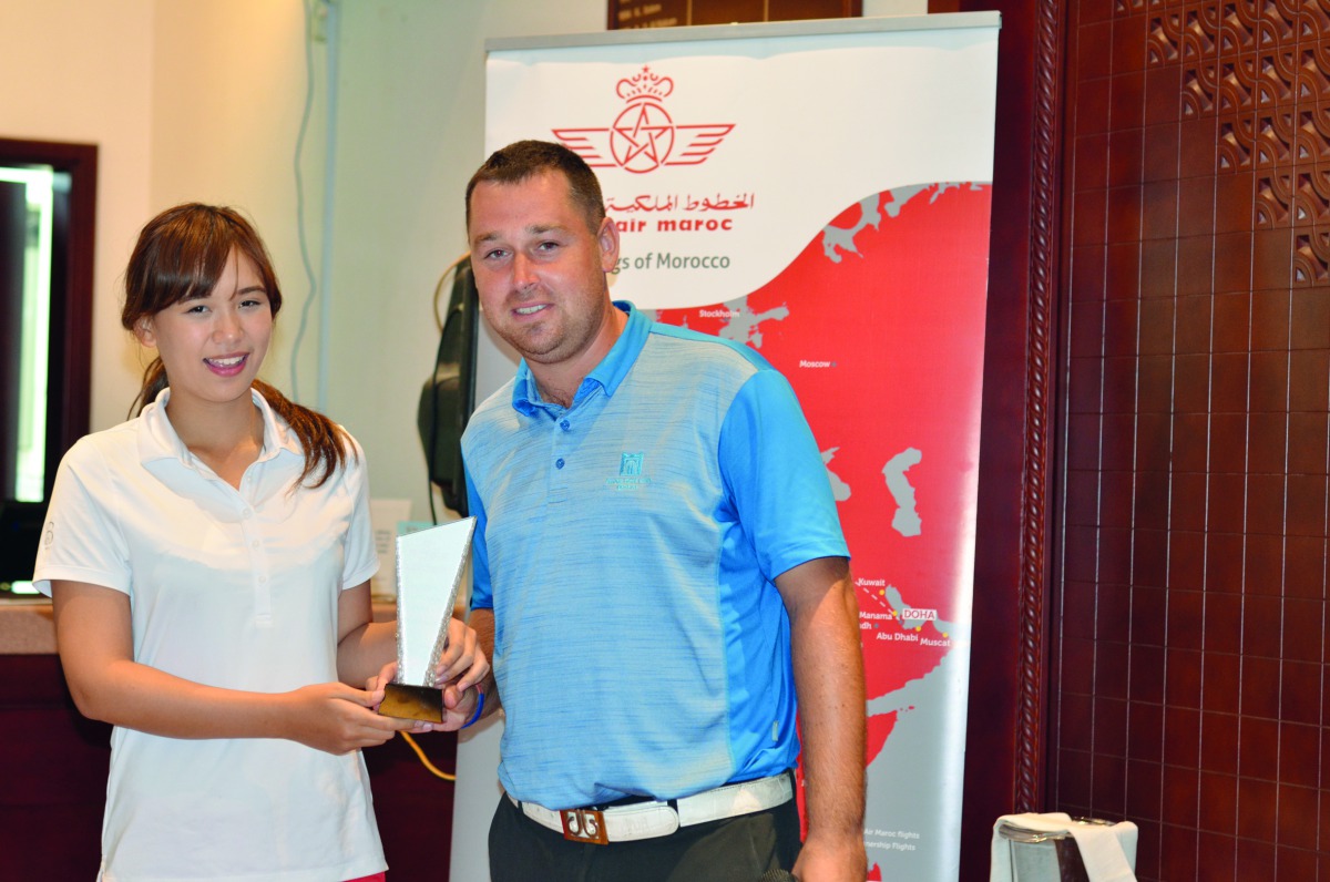 Kenza Gilmour, the Division two winner of the first leg of the Royal Air Moric tournament receiving her prize from Doha Golf Club’s Golf Operations Manager, Jordan Massey.