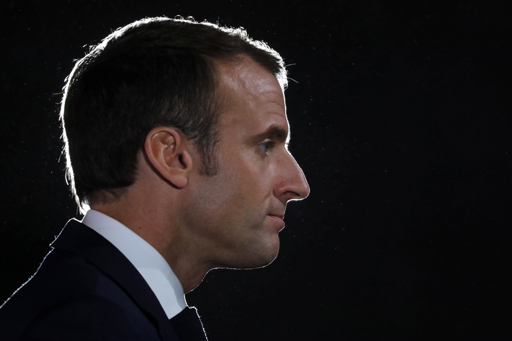 French President Emmanuel Macron speaks as he attends the economic event 