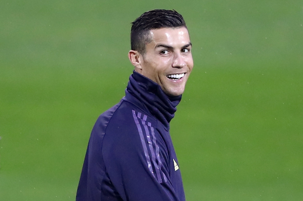Juventus' Portuguese forward Cristiano Ronaldo smiles during a training session at the Contassina training ground in Turin on November 6, 2018 on the eve of the UEFA Champions League group H football match Juventus vs Manchester. / AFP / Isabella BONOTTO