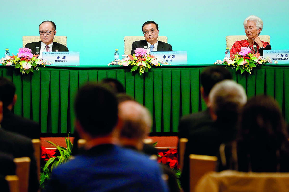 World Bank President Jim Yong Kim (L), Chinese Premier Li Keqiang (C) and International Monetary Fund (IMF) Managing Director Christine Lagarde attend a news briefing after the Third Round Table Dialogue in Beijing on November 6, 2018. AFP/ Thomas Peter
