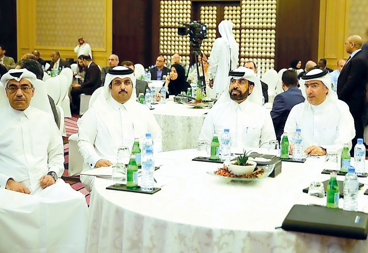 Rashid bin Ali Al Mansoori (second right), CEO of QSE, and other dignitaries during the event, yesterday.