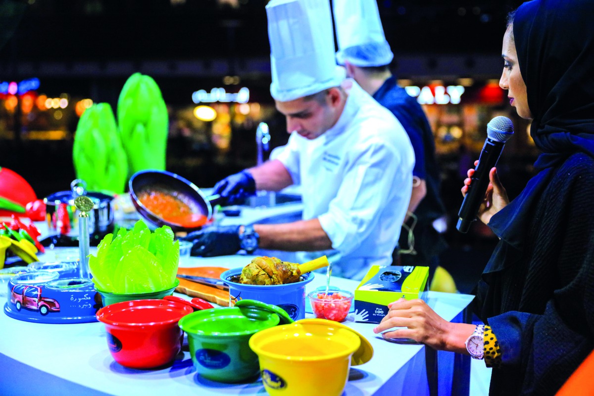 A chef preparing food at cooking show as part of the Taste Tour at Mall of Qatar. 
