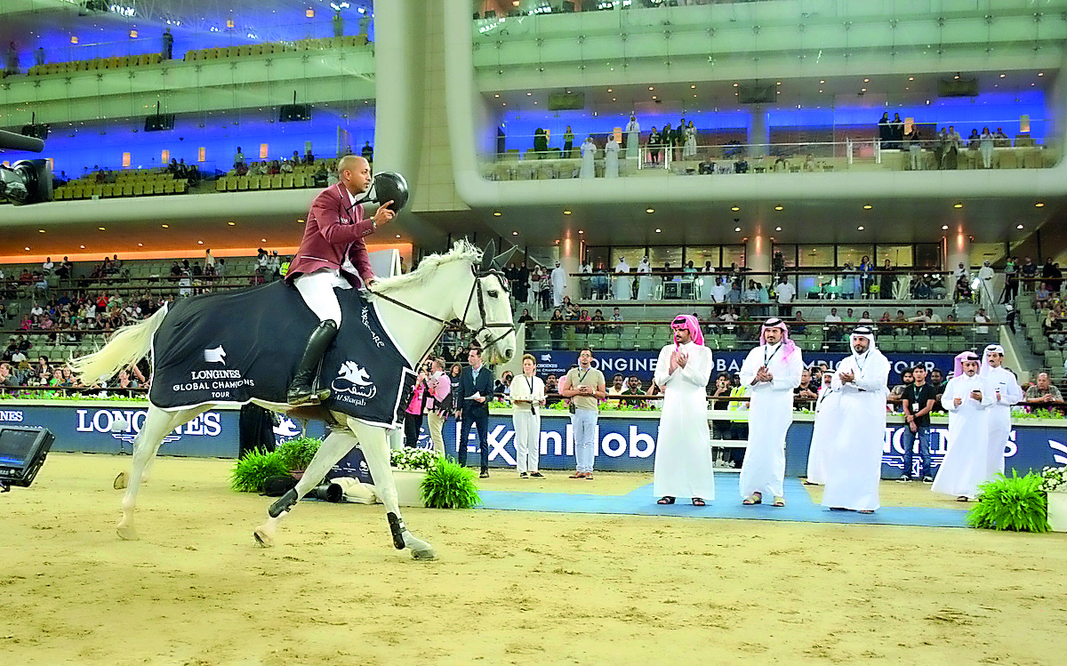 Qatari rider Bassem Hassan Mohammed acknowledges to H E Sheikh Joaan bin Hamad Al Thani, President of the Qatar Olympic Committee and the crowd after winning the Doha 2018 CSI5* 1.50m event during the final round of the Longines Global Champions Tour (LGC