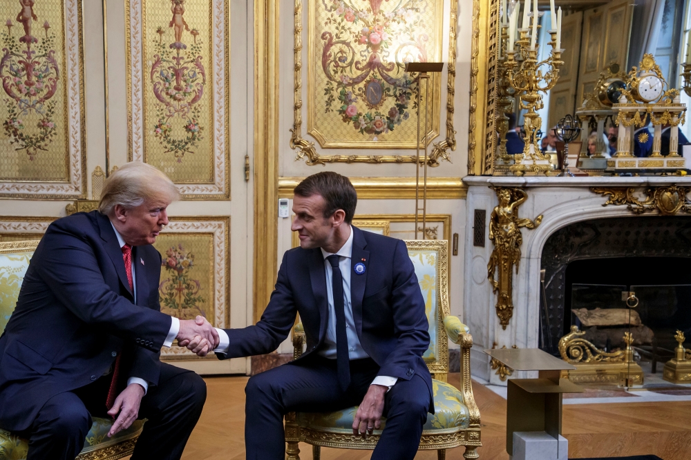 U.S. President Donald Trump and French President Emmanuel Macron shake hands during a meeting at Elysee presidential palace, as part of the commemoration ceremony for Armistice Day, 100 years after the end of the First World War, in Paris, France, Novembe