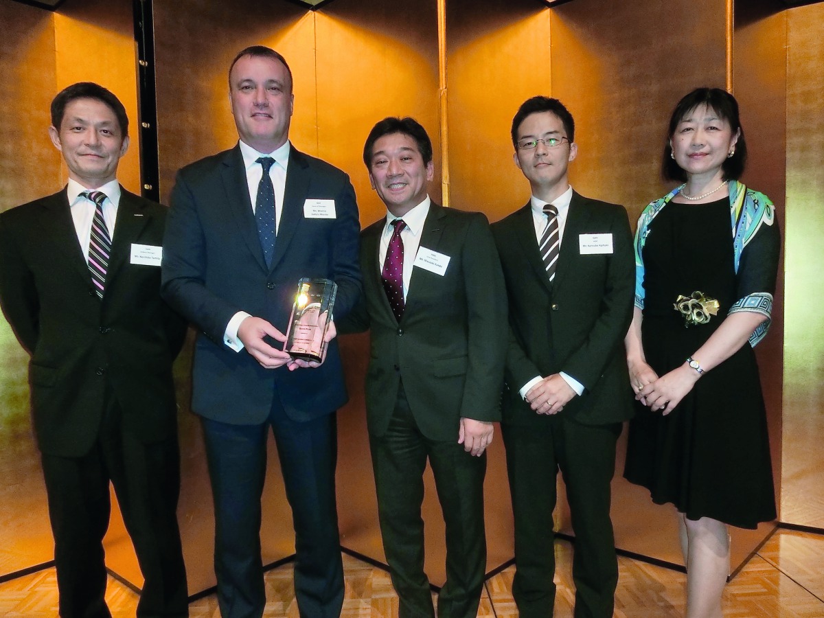 Martin Aherne, General Manager, Automotive at Saleh Al Hamad Al Mana Co, receiving the award presented by Norihide Tomita, General Manager,  Global Aftersales Network Department at Nissan Motors Corporation, in Japan.