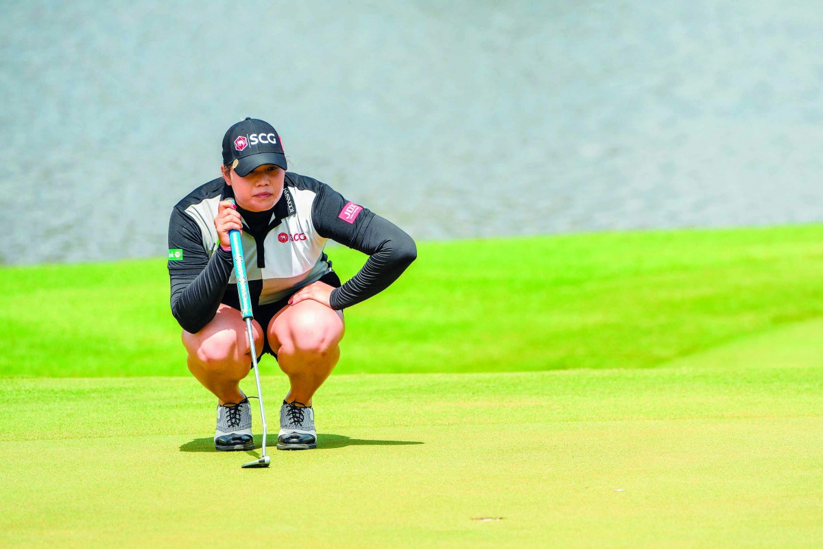 Ariya Jutanugarn of Thailand lines up a putt during the final round of the Blue Bay LPGA golf tournament in Sanya on China's Hainan Island on November 10, 2018. AFP 
