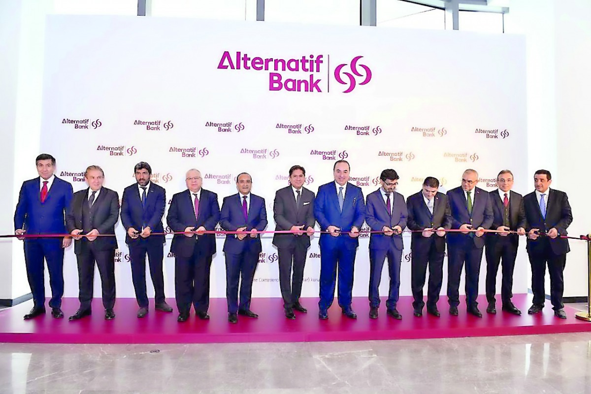 Top executives of Commercial Bank and Alternatif Bank cutting the ceremonial ribbon to mark the opening of Alternatif Bank head office in Istanbul.