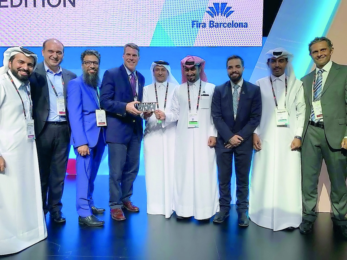 Jamal Al Kuwari (centre), Acting Chief Commercial Officer, Msheireb Properties,  with his team members during the Smart City Award ceremony in Barcelona.