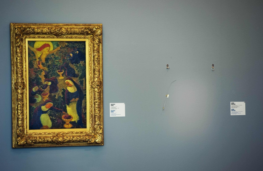 FILE PHOTO: In this file photo taken on October 16, 2012, an empty space is seen where a painting by French artist Henri Matisse was stolen at the Kunsthal museum in Rotterdam, a day after seven masterpieces were stolen in a pre-dawn heist. AFP / ANP / RO
