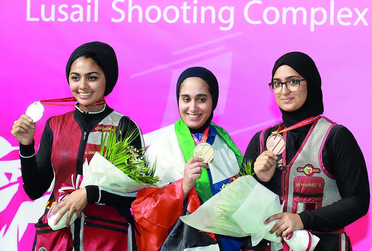 Kuwait’s Eman Alshamaa (centre) winner in the women’s skeet individual event is seen along with Qatar’s Reem Al Sharshani (left) and Sarah Mohamed, second and third place finishers.