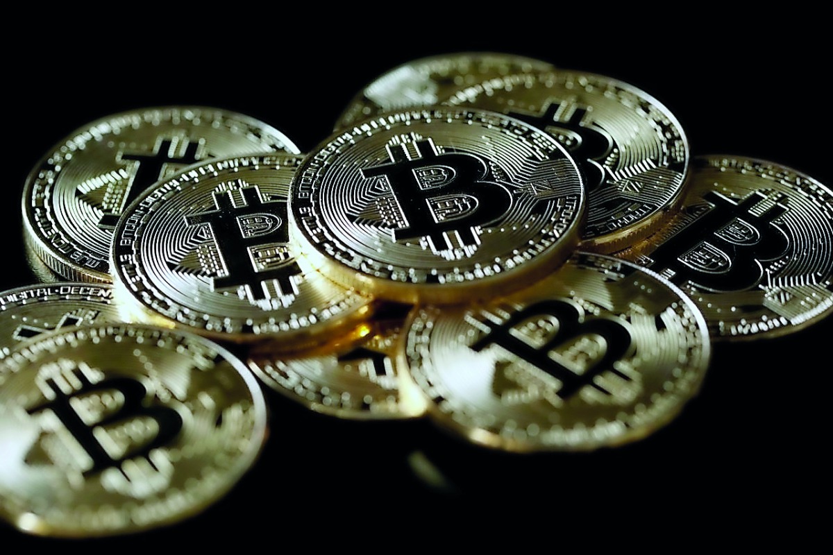 A collection of Bitcoin (virtual currency) tokens are displayed in this picture illustration taken December 8, 2017. Reuters/Benoit Tessier