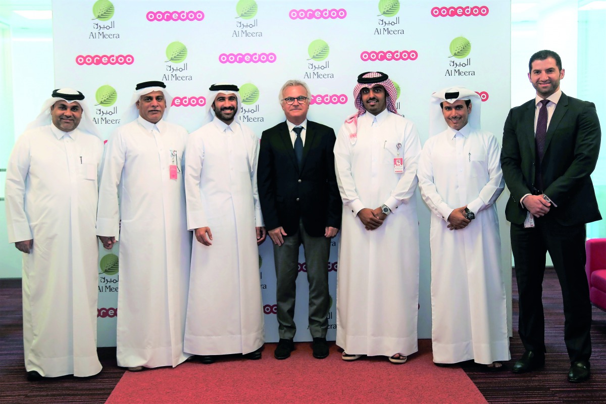 Yousuf Abdulla Al Kubaisi (second left), Chief Operating Officer, Ooredoo, Sheikh Nasser bin Hamad bin Nasser Al Thani, Chief Business Officer, Ooredoo, and other executives, after the signing ceremony in Doha yesterday.