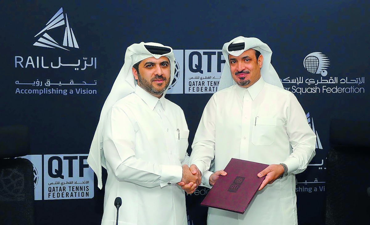 QTSBF Secretary General Tariq Zainal (left) and Chief of Strategy and Business Development Division at Qatar Rail Ajlan Eid Al Enazi shake hands after the signing ceremony yesterday.  