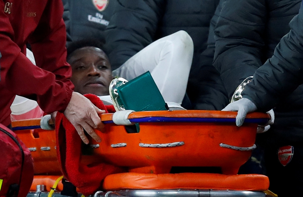 FILE PHOTO: Arsenal's Danny Welbeck leaves the pitch on a stretcher after sustaining an injury REUTERS/Eddie Keogh/File Photo
