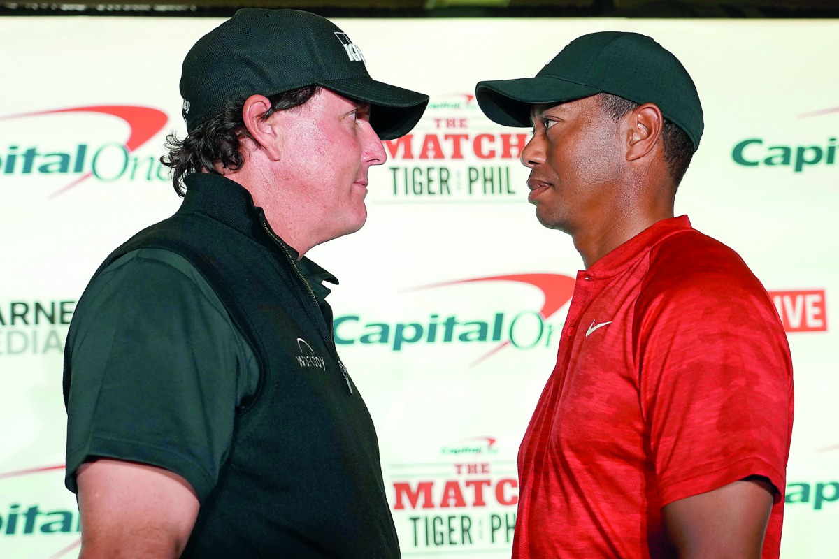 Phil Mickelson (left) and Tiger Woods (right) pose for a photo during a press conference before The Match: Tiger vs Phil golf match at Shadow Creek Golf Course. Credit: Kyle Terada-USA Today Sports 