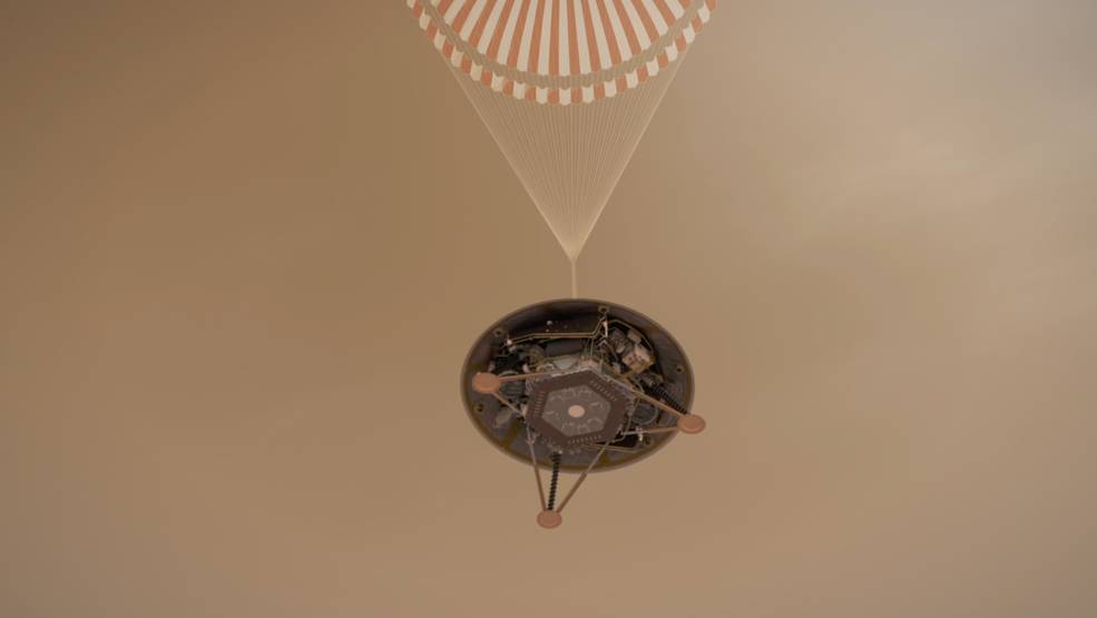 This illustration shows a simulated view of NASA's InSight lander descending on its parachute toward the surface of Mars. Credits: NASA/JPL-Caltech
