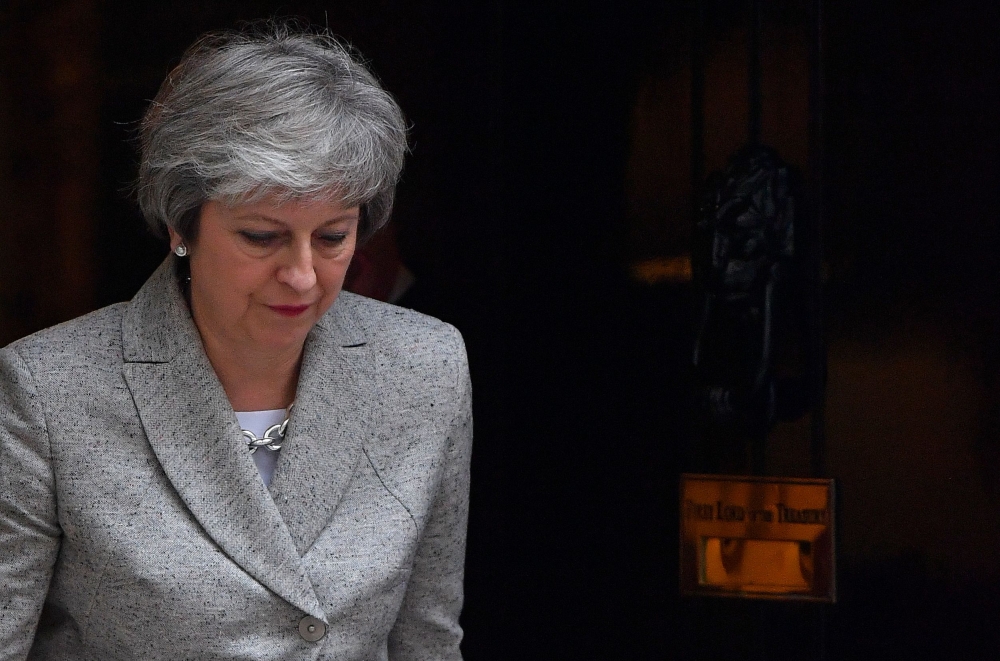 Britain's Prime Minister Theresa May arrives to give a statement outside 10 Downing Street in central London on November 22, 2018, following the announcement of a draft deal on post-Brexit trade ties with the EU.  AFP / Ben STANSALL
