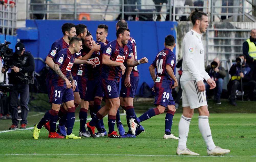 Eibar's Gonzalo Escalante celebrates scoring their first goal with teammates REUTERS/Vincent West