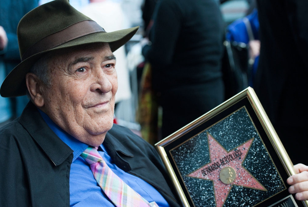 (FILES) In this file photo taken on November 19, 2013 Italian director Bernardo Bertolucci celebrates his Star on the Hollywood Walk of Fame in Hollywood, California. AFP / GETTY IMAGES NORTH AMERICA / Valerie MACON